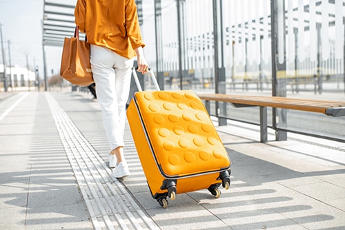 woman with yellow luggage
