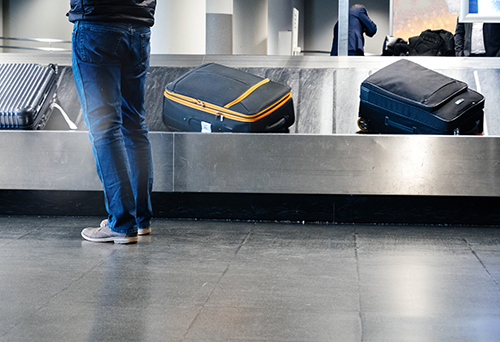 luggage on baggage claim carousel