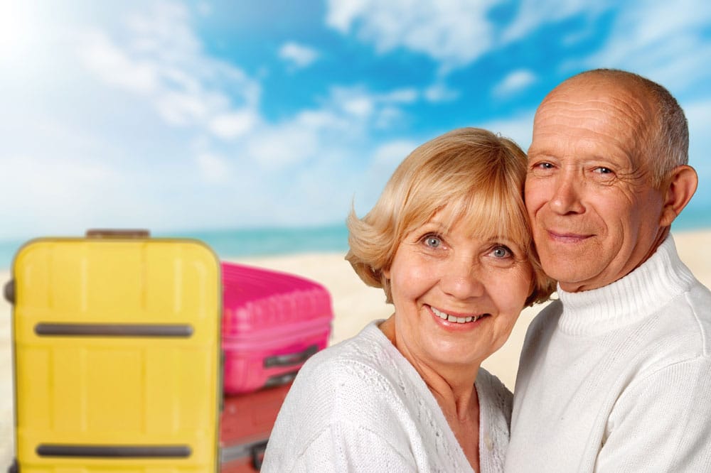 Mature white female physician checking male patients blood pressure at clinic